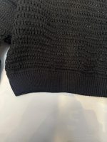 نمای نزدیک بافت زنبوری مشکی زنانه